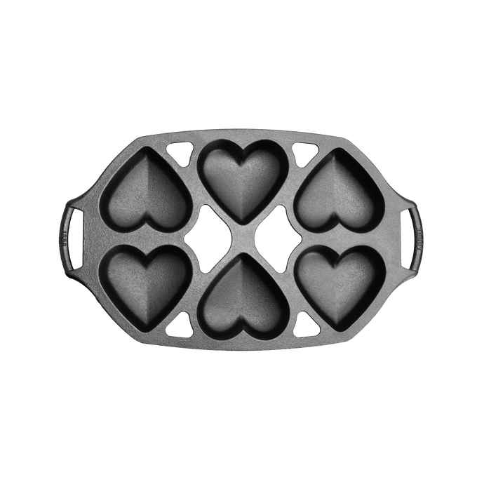 Cast iron mini cake pan with six heart-shaped cavities, designed for baking petite cakes, handcrafted in USA, featured in Kitchen & Food, Cookware, Cast Iron, and Baking Supplies collections.