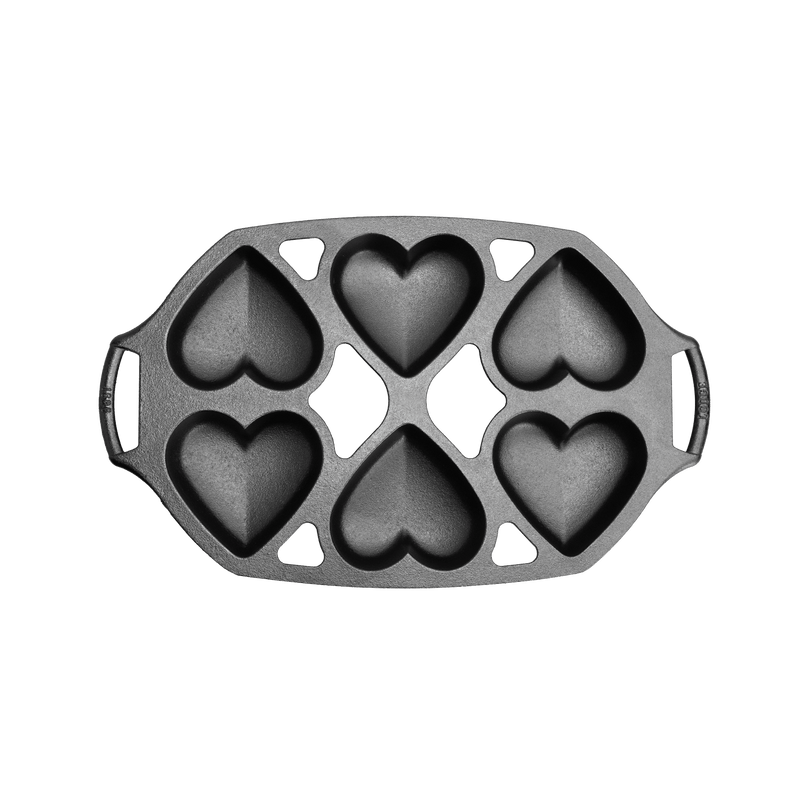 Cast iron mini cake pan with six heart-shaped cavities, designed for baking petite cakes, handcrafted in USA, featured in Kitchen & Food, Cookware, Cast Iron, and Baking Supplies collections.