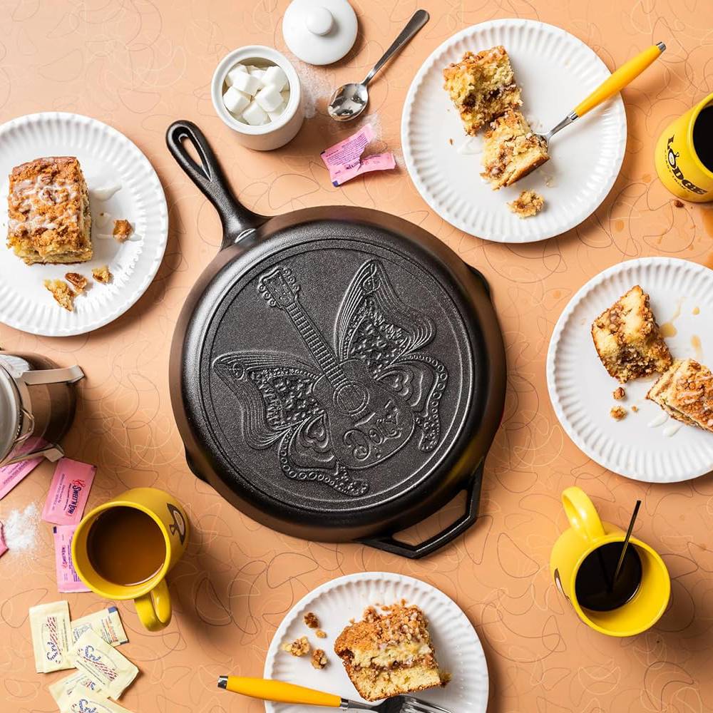 12-inch cast iron skillet with embossed butterfly and guitar design, seasoned with natural vegetable oil, handcrafted in USA, featured in Kitchen & Food, Cookware, Cast Iron, USA Made, Best Sellers, and Promo Eligible collections.