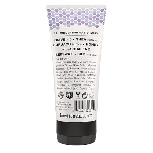 Back view of a 6 fl oz tube of Beessential Hand and Body Cream highlighting natural ingredients like olive oil, shea butter, honey, beeswax, and silk protein, handcrafted in USA, featured in Health & Wellness, Balms, Creams and Lotions, USA Made, Best Sellers, Promo Eligible, and Sale collections.
