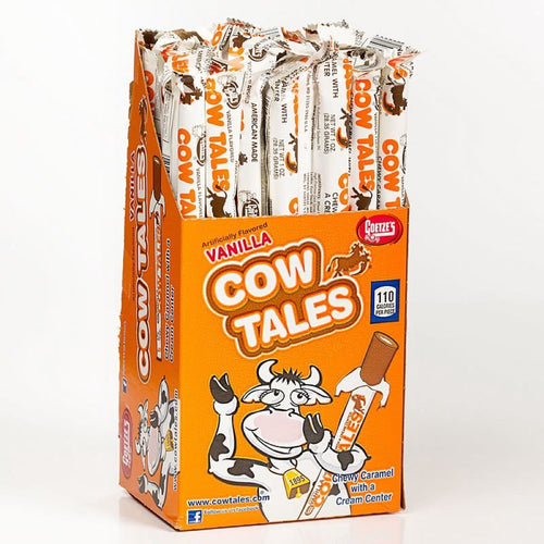 Bright orange box of individually wrapped vanilla caramel chew sticks with a playful cow illustration, made in USA, featured in Snacks and Sweets, Candy, and Best Sellers collections.