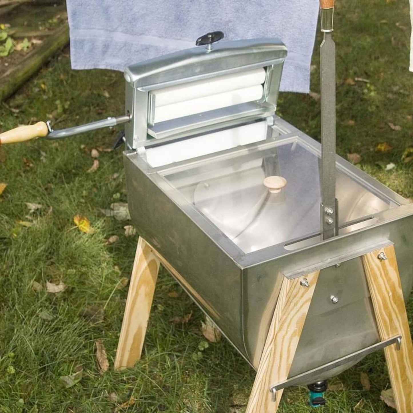 Amish-inspired hand washer featuring a stainless steel basin, clear lid, wooden crank handle, and sturdy wooden legs, designed for efficient laundry in Home & Decor and USA Made collections.