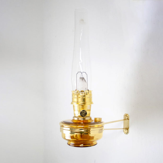 Handcrafted amber glass wall oil lamp with brass mounting bracket, designed for bright, electric-level light and long-lasting use, ideal for Farm, Garden & Tool and Lighting collections.