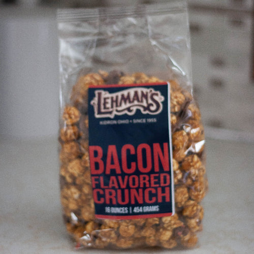 Clear bag of handcrafted caramel popcorn with savory bacon-flavored crunch, a unique sweet and savory snack made in USA, perfect for Kitchen & Food, Snacks and Sweets, Popcorn, USA Made, Best Sellers, and Promo Eligible collections.