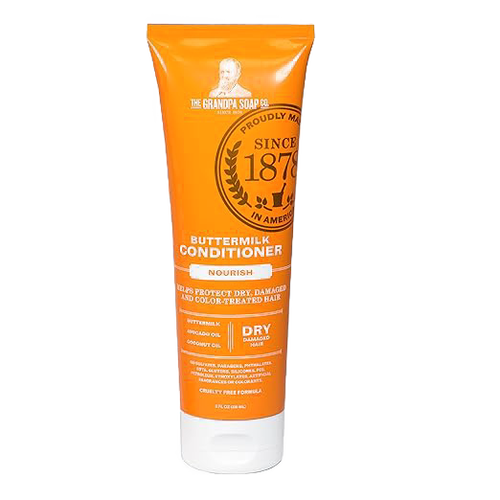 Bright orange tube of nourishing buttermilk conditioner designed for dry and color-treated hair, promoting gentle daily care, cruelty-free formula, featured in Health & Wellness and USA Made collections.