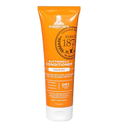 Bright orange tube of nourishing buttermilk conditioner designed for dry and color-treated hair, promoting gentle daily care, cruelty-free formula, featured in Health & Wellness and USA Made collections.