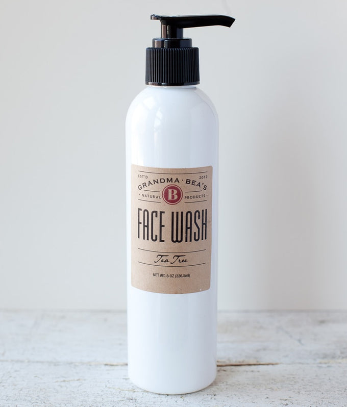 White 8-ounce pump bottle of handcrafted all-natural tea tree face wash with a brown label, made in the USA and featured in Health & Wellness and Grooming collections.