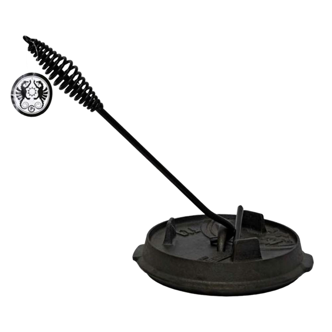 Black metal lid lifter with coiled handle resting on a seasoned cast iron pot lid, designed for safe handling during camping and outdoor cooking, featured in Farm, Garden & Tool and Best Sellers collections.