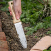 Handcrafted hori hori gardening knife with smooth wooden handle and serrated stainless steel blade featuring measurement markings, used in Farm, Garden & Tool, Digging and Cultivating, Garden Accessories, Best Sellers, and Promo Eligible collections.