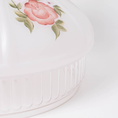 Close-up of a handcrafted glass lamp shade featuring a soft white base with delicate red rose and green leaf design, part of Lamps & Lighting and Best Sellers collections.