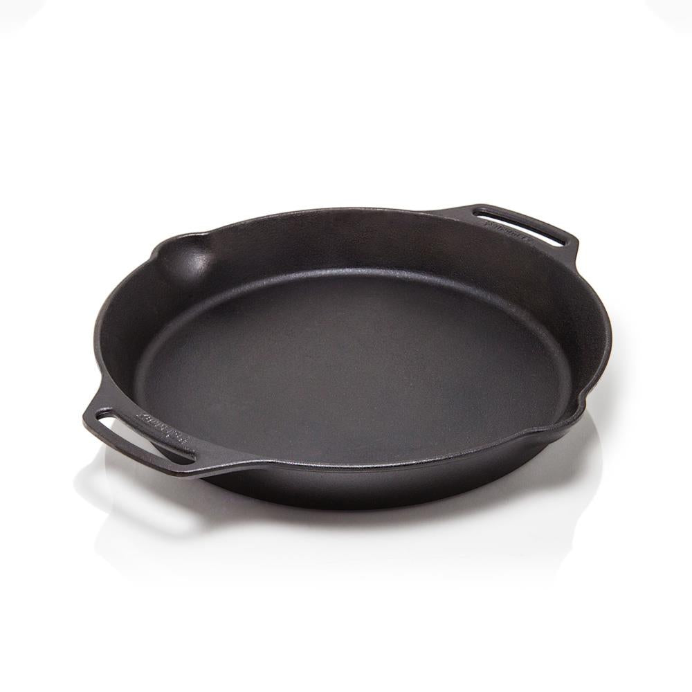 Heavy-duty round cast iron skillet with two side handles and a small pour spout, crafted for versatile use in farm, garden, camping, kitchen, cookware, and cast iron collections.
