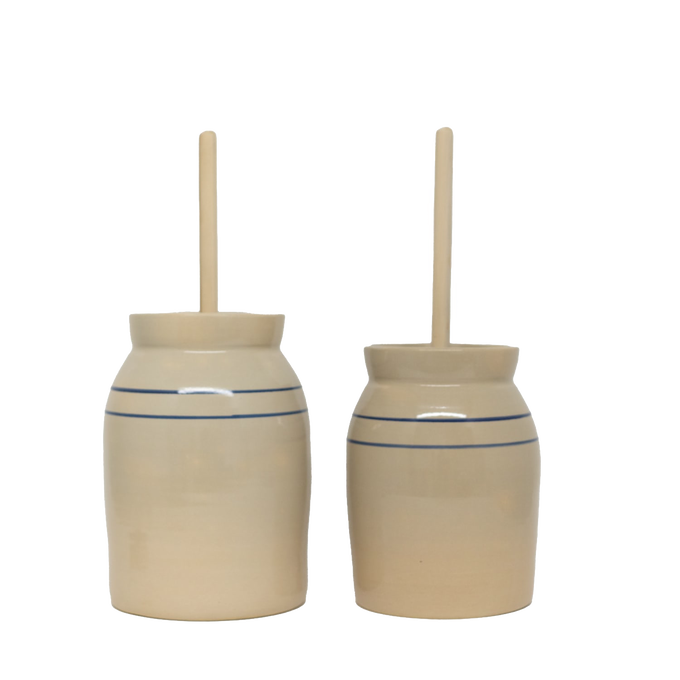 Pair of handcrafted stoneware butter churns in natural color with smooth wooden dashers and classic double blue stripes, made in USA, featured in Kitchen & Food and Specialty Equipment collections.