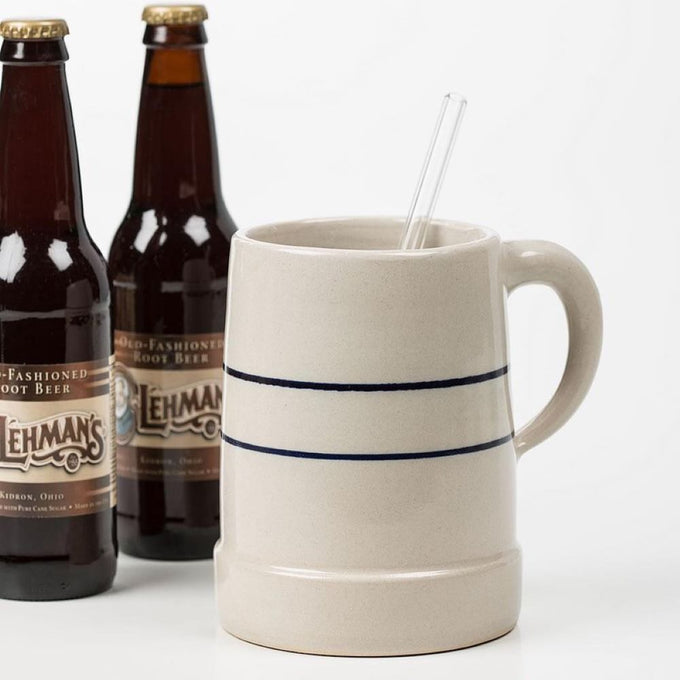 Handcrafted stoneware large stein in natural color with two blue horizontal stripes and sturdy handle, featured in Kitchen & Food, Dinnerware, USA Made, and Best Sellers collections.