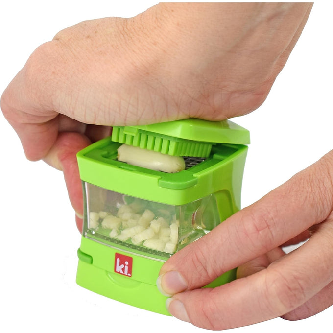 Compact green garlic prep tool with clear container for storing peeled and minced garlic, designed for Kitchen & Food, Food Prep, Choppers and Cutters, and Kitchen Gadgets collections.