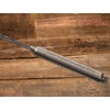 Handcrafted cast iron campfire bread baker with heavy-duty wooden handles, designed for outdoor cooking, ideal for camping, kitchen, cookware, and farm tool collections.