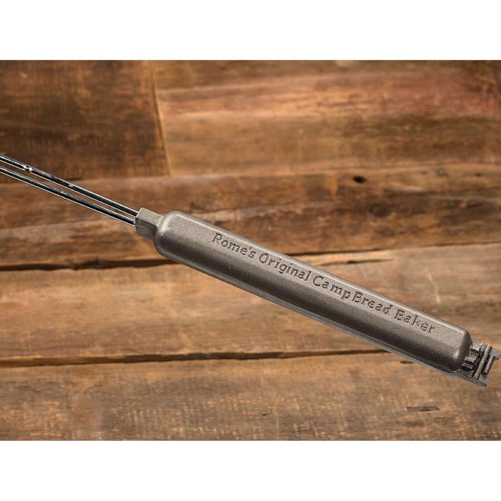 Handcrafted cast iron campfire bread baker with heavy-duty wooden handles, designed for outdoor cooking, ideal for camping, kitchen, cookware, and farm tool collections.