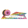 Brightly colored jigsaw puzzle pieces forming a rainbow donut collage next to an embossed metal tin shaped like a frosted donut, ideal for children's toys and puzzles collections.