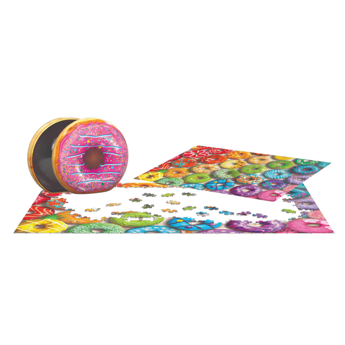 Brightly colored jigsaw puzzle pieces forming a rainbow donut collage next to an embossed metal tin shaped like a frosted donut, ideal for children's toys and puzzles collections.