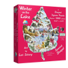Brightly colored puzzle box featuring a handcrafted leaf-shaped jigsaw puzzle with a winter lake scene, eco-friendly materials, and recommended for ages 10 and up in USA made collections.