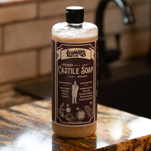 Clear bottle of handcrafted Lehman's concentrated castile liquid soap in lavender scent, featuring plant-based oils, placed on a kitchen counter near a faucet, highlighting natural, multi-use, USA made soap from Health & Wellness, Grooming and Personal Hygiene, Soaps and Soapmaking collections.