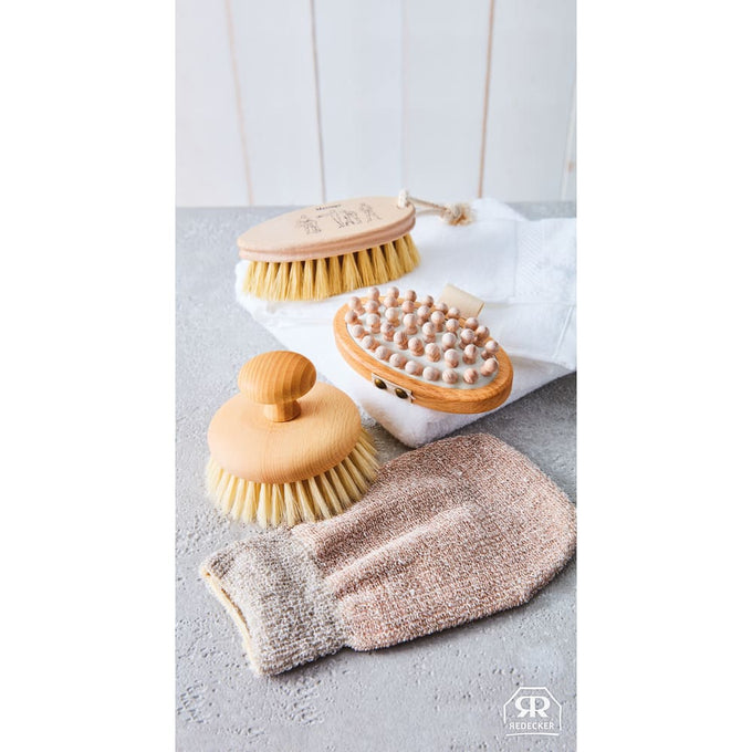 Set of natural wooden bath brushes and a textured exfoliating mitt arranged on a gray surface, ideal for stimulating circulation and skincare routines in Health & Wellness, Grooming and Personal Hygiene, Best Sellers, and Promo Eligible collections.