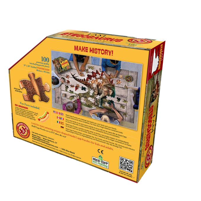 Yellow puzzle box featuring a shaped dinosaur jigsaw with 100 pieces, showcasing hands assembling the Stegosaurus image, part of Toys, Books & Games and Children's Toys collections.