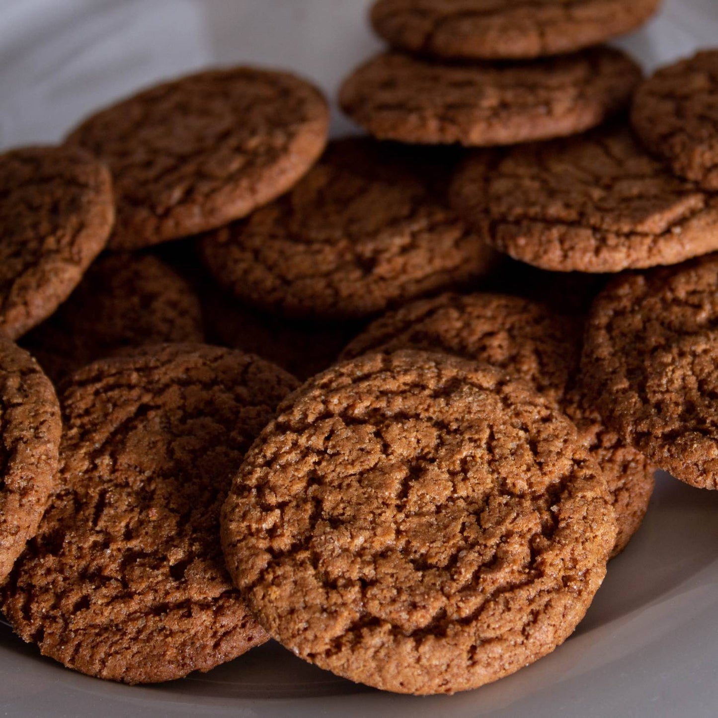 Close-up of handcrafted crispy ginger snap cookies with a rich texture, made in USA, perfect for Kitchen & Food, Snacks and Sweets, USA Made, Best Sellers, and Promo Eligible collections.