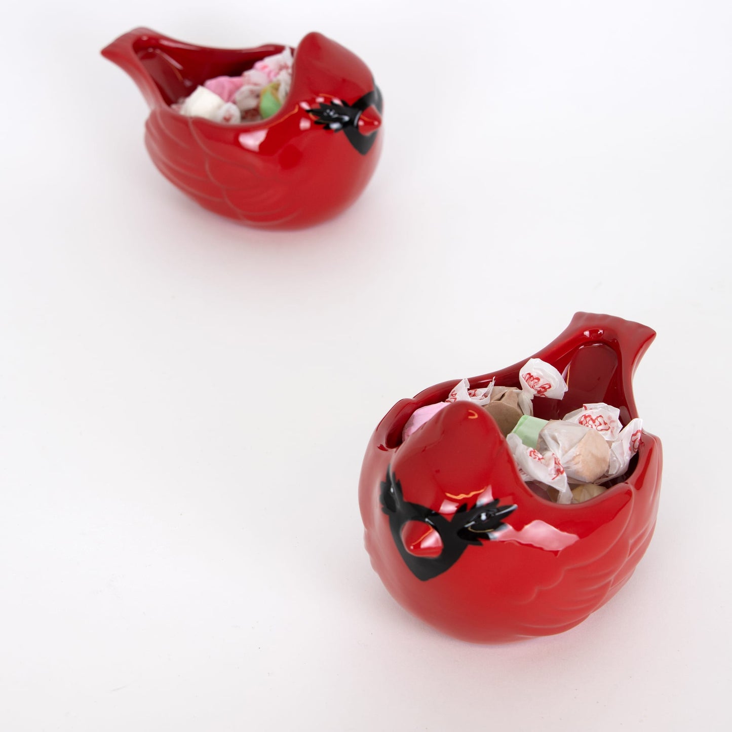 Glossy red handcrafted cardinal-shaped bowl holding wrapped candies, ideal for festive holiday decor, kitchen serving, and featured in Home & Decor, Kitchen & Food, and Dinnerware collections.