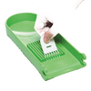 Handcrafted green chopper blade plate held by hand above matching green base, designed for easy vegetable and fruit prep, featured in Kitchen & Food, Food Prep, Choppers and Cutters, Kitchen Gadgets, Kitchen Accessories, Best Sellers, Promo Eligible collections.