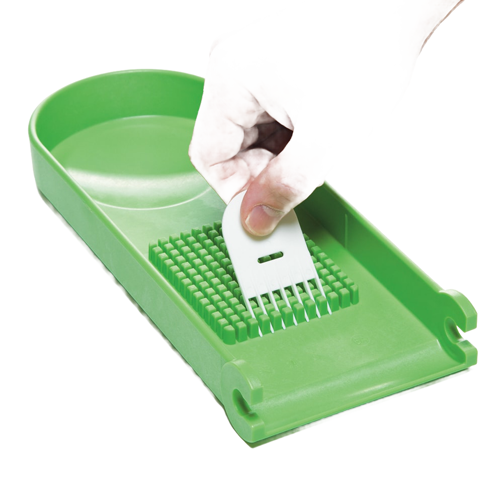 Handcrafted green chopper blade plate held by hand above matching green base, designed for easy vegetable and fruit prep, featured in Kitchen & Food, Food Prep, Choppers and Cutters, Kitchen Gadgets, Kitchen Accessories, Best Sellers, Promo Eligible collections.