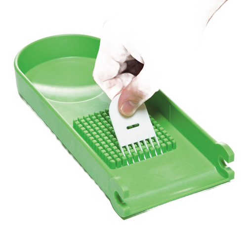 Handcrafted green chopper blade plate held by hand above matching green base, designed for easy vegetable and fruit prep, featured in Kitchen & Food, Food Prep, Choppers and Cutters, Kitchen Gadgets, Kitchen Accessories, Best Sellers, Promo Eligible collections.