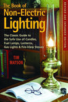 Book cover featuring a vintage brass oil lamp with a tall glass chimney, resting on a wooden table beside an open book and reading glasses, in a cozy home library setting.