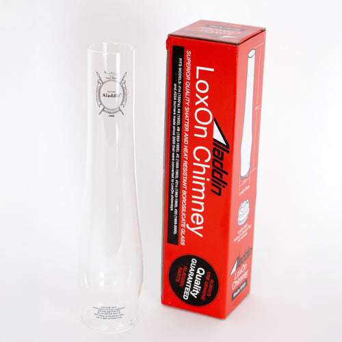 Clear Aladdin Standard chimney designed for lamps, shown next to bold red packaging emphasizing shatter resistance and heat durability, ideal for Lamps & Lighting, Parts and Accessories, Chimneys and Globes, Best Sellers, and Promo Eligible collections.