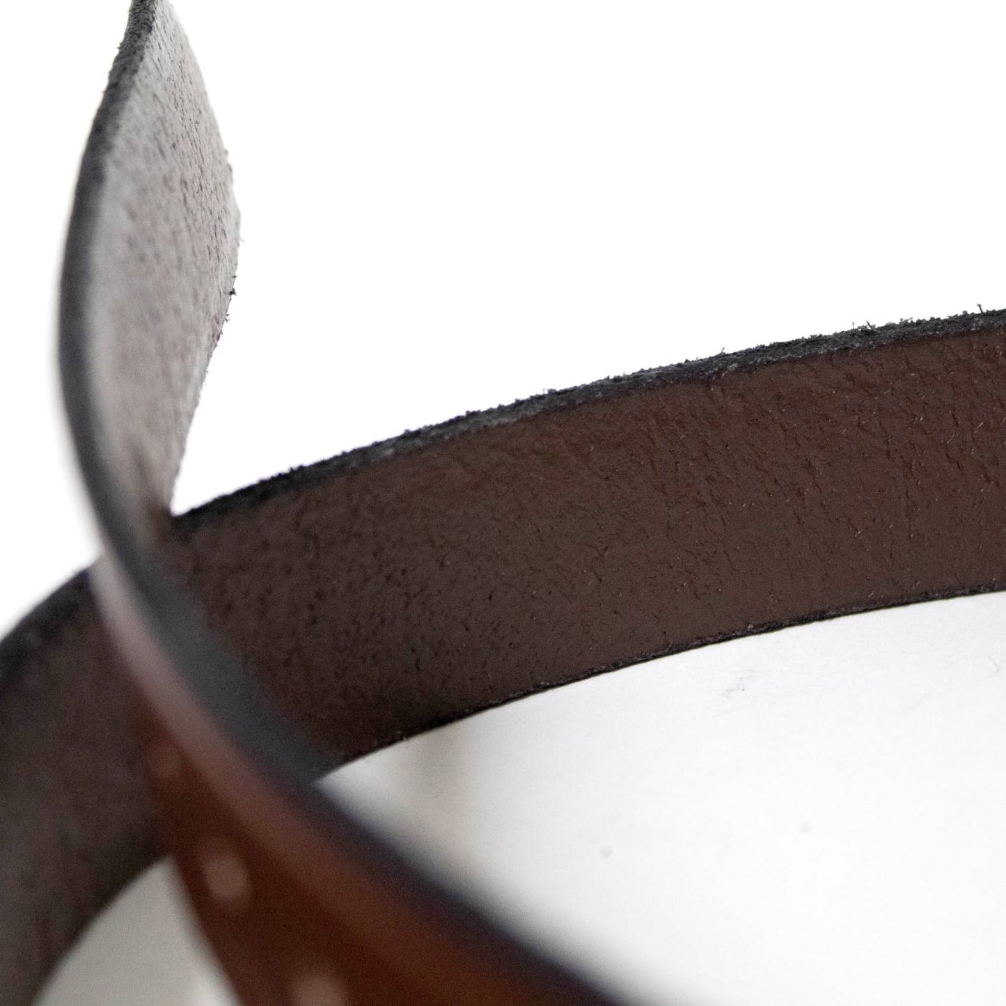 Close-up of the textured inner side of a handcrafted Amish-made genuine cowhide leather belt in rich brown, featured in Health & Wellness, Clothing and Accessories, USA Made collections.