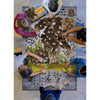 Overhead view of six children collaborating on a unique-shaped Sasquatch puzzle with 1000 interlocking pieces, surrounded by puzzle pieces and a colorful booklet, featured in Toys, Books & Games and Children's Toys collections.