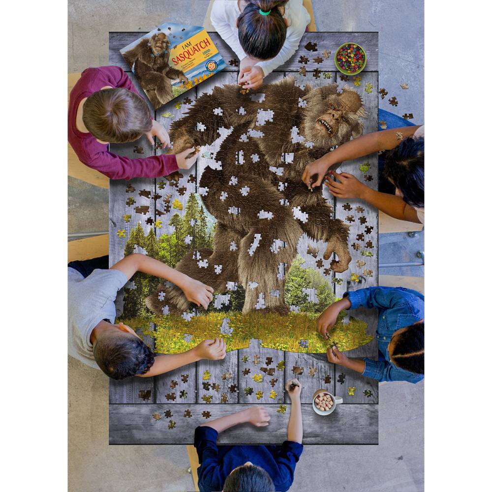 Overhead view of six children collaborating on a unique-shaped Sasquatch puzzle with 1000 interlocking pieces, surrounded by puzzle pieces and a colorful booklet, featured in Toys, Books & Games and Children's Toys collections.