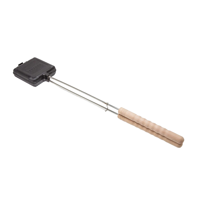 Cast iron sandwich iron with hinged mold and wooden handle, designed for toasting sandwiches over campfires, featured in Farm, Garden & Tool, Camping, Best Sellers, and Promo Eligible collections.