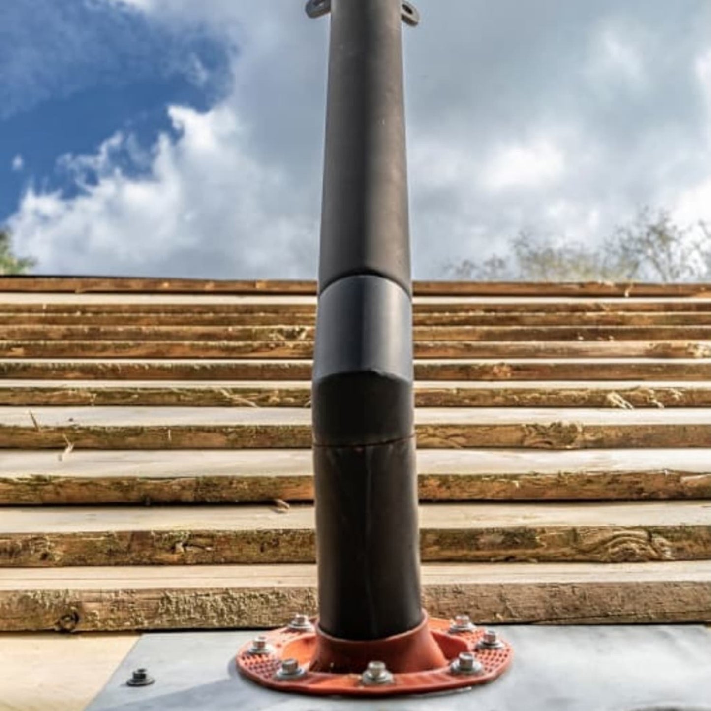 Close-up of a sturdy metal pipe securely mounted with bolts on a tent base, designed for safe installation and use with camping and outdoor gear in Farm, Garden & Tool and Best Sellers collections.