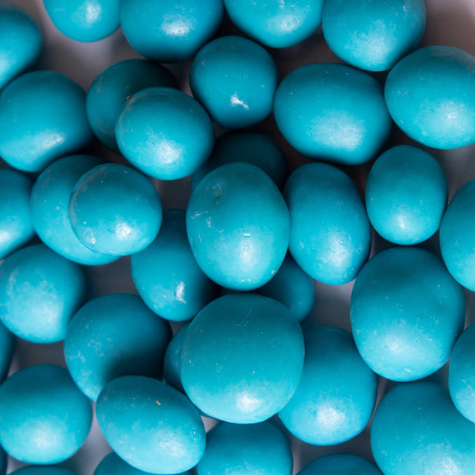 Close-up of vibrant blue handcrafted chocolate-covered blueberries, perfect for Kitchen & Food, Snacks and Sweets, Candy, USA Made, and Best Sellers collections.