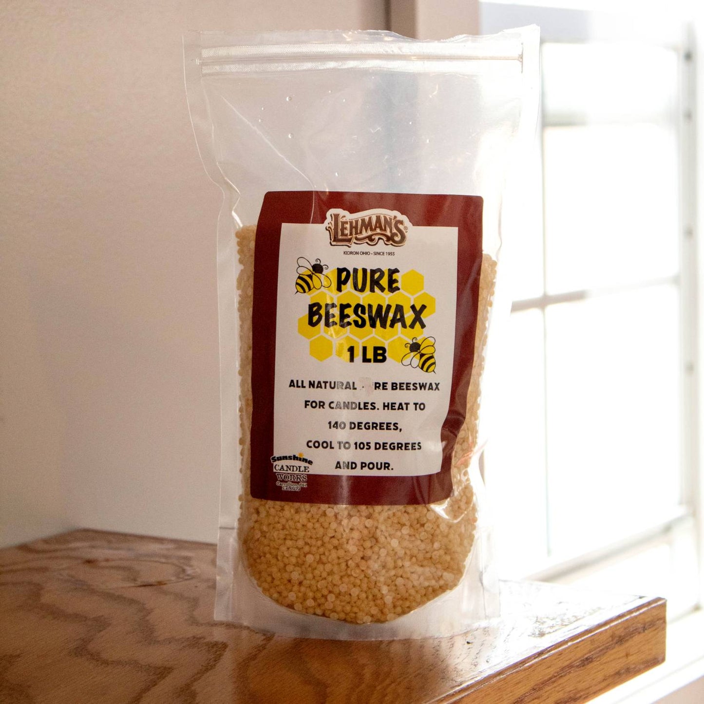 Clear resealable bag of natural beeswax pellets, handcrafted and ideal for candle making, featured in lamps & lighting, candlemaking supplies, and best sellers collections.