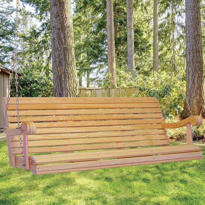 Handcrafted 5-foot cypress porch swing with smooth slatted seat and back, hanging from durable chains between large trees in a lush backyard, ideal for Home & Decor and Outdoor Furniture collections.