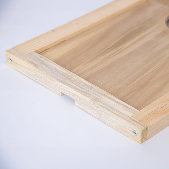 Handcrafted Amish made wooden hive inner cover with a central notch for ventilation, designed for moisture control in beekeeping and featured in USA made farm, garden, and tool collections.