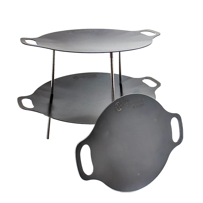 Two-tier steel griddle and fire bowl set with integrated handles and detachable legs, designed for stable outdoor cooking, ideal for Farm, Garden & Tool, Camping, Best Sellers, and Promo Eligible collections.