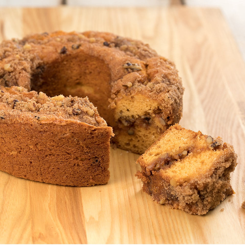 Handcrafted butterscotch coffee cake made in USA with sweet molasses and crunchy walnuts, shown sliced on a wooden board, part of Kitchen & Food and Snacks and Sweets collections.