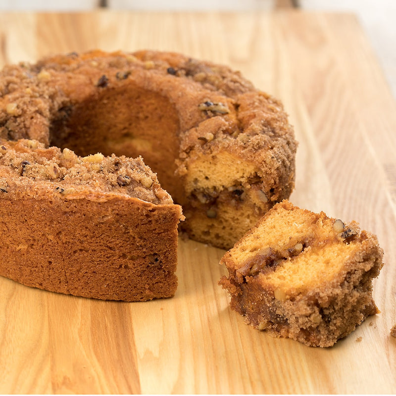 Handcrafted butterscotch coffee cake made in USA with sweet molasses and crunchy walnuts, shown sliced on a wooden board, part of Kitchen & Food and Snacks and Sweets collections.