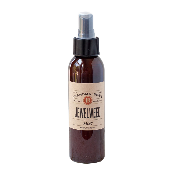 Amber spray bottle with natural label reading "Jewelweed Mist," designed for Health & Wellness, Balms, Creams and Lotions, and USA Made collections.