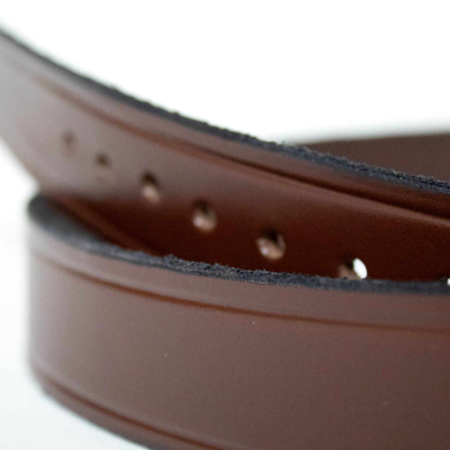 Close-up of a unique handcrafted Amish made brown genuine cowhide leather belt, 1-1/4 inches wide with punched holes, featured in Health & Wellness, Clothing and Accessories, USA Made, Amish Made, Best Sellers, and Promo Eligible collections.