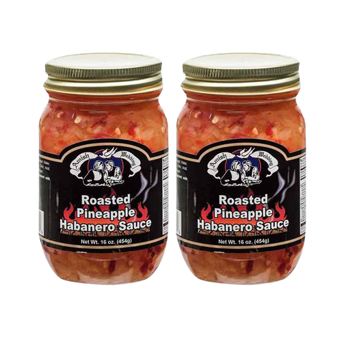 Two jars of roasted pineapple habanero sauce with a black label featuring white text and a graphic, crafted in the USA, ideal for Kitchen & Food and Pantry collections.