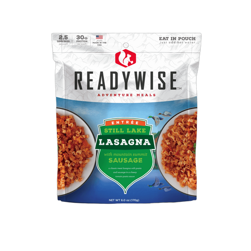 Resealable pouch of ReadyWise Still Lake Lasagna with Sausage meal featuring a mountain-themed label, highlighting 2.5 servings, 30 grams protein, made in USA, ideal for camping, pantry, and emergency supplies.