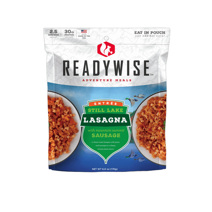Resealable pouch of ReadyWise Still Lake Lasagna with Sausage meal featuring a mountain-themed label, highlighting 2.5 servings, 30 grams protein, made in USA, ideal for camping, pantry, and emergency supplies.